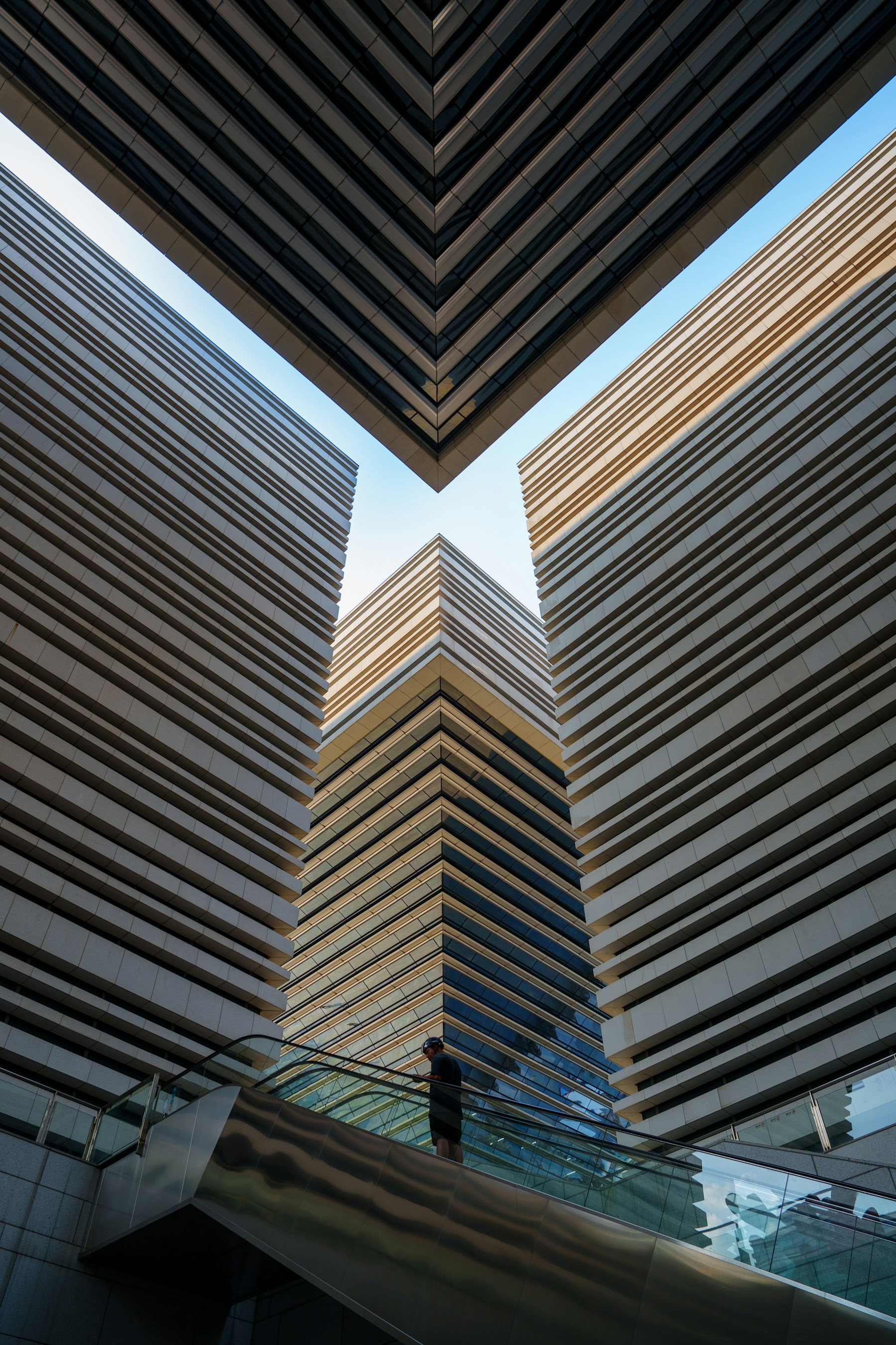 Modern architectural infrastructure with strong geometric lines and warm sunlight